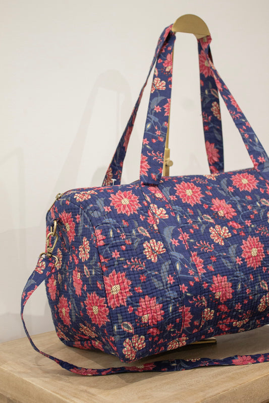 Bolsa de viaje azul marino flores rosas